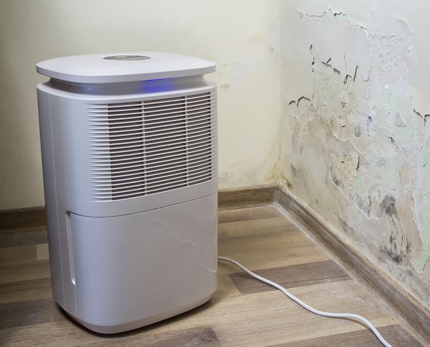 A dehumidifier is a device that can draw moisture out of the surrounding air and then separate the moisture as water into a container or a drain